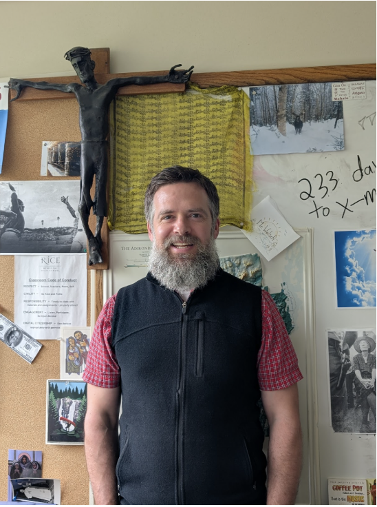 Patrick Welsch with his prayer flag in his classroom. (Photo/Amelia Farley)